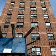 Temporary scaffolding at the Coney Island Houses, which residents say block security cameras, making the area unsafe.