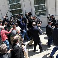 Staten Island congressman Michael Grimm is mobbed by reporters following his arraignment on federal fraud charges in Brooklyn. Grimm denies the allegations in the 20-count federal indictment.
