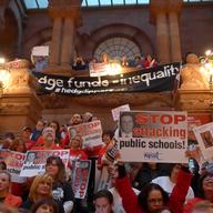 Teachers rallied in Albany against the governor's plan to make student test scores count for more of their ratings