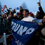 Supporters of Donald Trump rallied outside of his campaign event in Bethpage, Long Island. They faced off against more than 100 protesters on the other side of barriers.