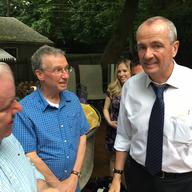 Neighbors gather in a West Orange, N.J., backyard meet gubernatorial candidate Phil Murphy. 