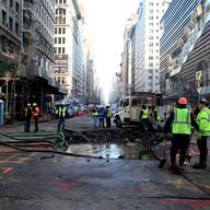 A water main break early on January 15, 2013 leaves a crater in the street at 13th Street and 5th Avenue.