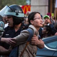 A woman is arrested during a demonstrations near Union Square on April 29, 2015.