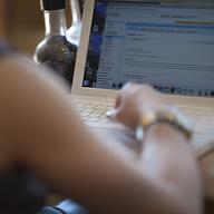 working on laptop at coffee shop