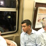 City councilman Ydanis Rodriguez and State Assemblyman Jeff Dinowitz talk to subway riders during the first leg of their 12-hour day on the subways.