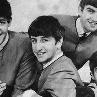 The Beatles, on the cover of the single for 'I Want To Hold Your Hand.'