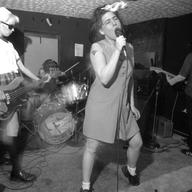 Bikini Kill performs in Washington, D.C., in the 1990s.