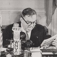 Mayor LaGuardia reads the comics over WNYC in July, 1945.