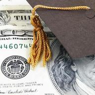 graduation cap on money