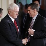 Vice President Mike Pence and National Security Adviser Michael Flynn, right, shake hands on February 10, 2017.