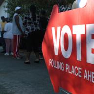 A sign points to voters lined up to cast their ballots at a polling place November 2, 2004 in St. Petersburg, Florida.