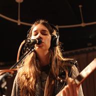 Middle sister Danielle Haim on lead guitar.