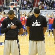 Members of the Georgetown University basketball team line up for the national anthem wearing 'I Can't Breathe' t-shirts to honor Eric Garner, who died while being placed in a police chokehold.