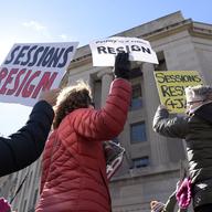Protestors gather outside the Justice Department in Washington, Thursday, March 2, 2017, during a demonstration against Attorney General Jeff Sessions.