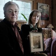 Jim Cagey and Anne Roberts with a photo of their son Patrick at their Lexington, Kentucky home.