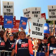 Americans hold up 'I want to work' placards as they join a protest of several thousand people demanding jobs outside City Hall in Los Angeles on August 13, 2010. 