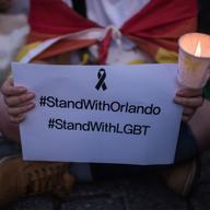 Members of South Korea's LGBT community hold a candle-light vigil for victims of the Orlando shooting, in Seoul on June 13, 2016. 