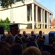 A brass ensemble from the Metropolitan Opera Orchestra performs at a Local 802 rally at Lincoln Center