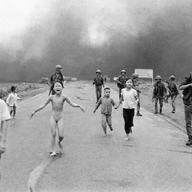 South Vietnamese forces follow after terrified children, including 9-year-old Kim Phuc, center, after an aerial napalm attack on suspected Viet Cong hiding places, June 8, 1972.