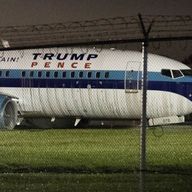 GOP vice presidential candidate Mike Pence's campaign airplane sits partially on the tarmac and the grass after sliding off the runway while landing at LGA Thu Oct 27, 2016