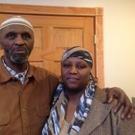 Muhammad, pictured with his daughter Hameenah Muhammad, says the person who shot and killed his son last year has still not been found.