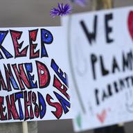 Signs in support of Planned Parenthood at Fillmore Street and Centennial Boulevard on November 29, 2015 in Colorado Springs, Colorado.