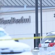 The taped off parking lot of the Planned Parenthood at Fillmore Street and Centennial Boulevard on November 29, 2015 in Colorado Springs, Colorado.