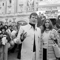 Roger Moore is accompanied by co-star Barbara Bach as they arrive for the screening of 'The Spy Who Loved Me' at the Cannes Film Festival 