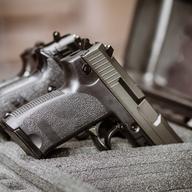 black handgun in plastic Secure Storage Case