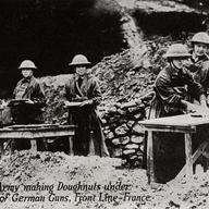 Salvation Army making Donuts - postcard depicting Salvation Army making donuts under bombardment of German guns while in front line in France during WWI, circa 1914-1918. 