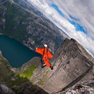 A B.A.S.E. jumper in wingsuit jumps off a cliff August 21, 2010, in Kjerag, Norway. Wingsuit cliff jumping is an advanced discipline, it makes human flight possible. 