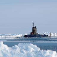 The extent of sea level rise depends partially on how quickly polar ice caps melt. Above, the British HMS Tireless submarine at the North Pole.