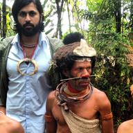 Vikram Gandhi with Munago, a local shaman, and his sons in Hela Province, Papau New Guinea.