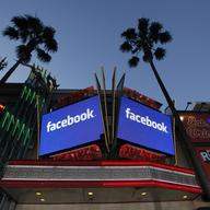 Screens outside the Grauman's Chinese Theatre on Hollywood Blvd. advertise Facebook's IPO.