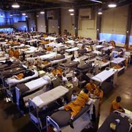  In this May 20, 2009 file photo, several hundred inmates crowd the gymnasium at San Quentin prison in San Quentin, Calif. 