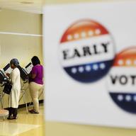 This Nov. 1, 2016 file photo, shows voters casting ballots during early voting in Atlanta. 