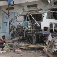 A man inspects the wreckage of a bus at the site of a deadly Saudi-led coalition airstrike on Thursday, in Saada, Yemen, Sunday, Aug. 12, 2018.