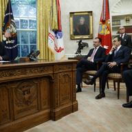 President Donald Trump talks on the phone with Mexican President Enrique Pena Nieto, in the Oval Office of the White House, Monday, Aug. 27, 2018, in Washington. 