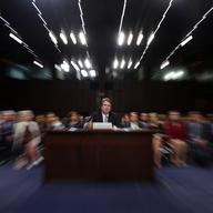 In this photo taken with a slow shutter speed and a zoom, President Donald Trump's Supreme Court nominee, Brett Kavanaugh testifies before the Senate Judiciary Committee on Capitol Hill