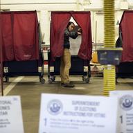 Voters cast their ballots at the fire house in Teaneck, N.J., Tuesday, Nov. 7, 2017.