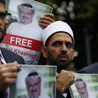 In this Monday, Oct. 8, 2018 file photo, members of the Turkish-Arab Journalist Association hold posters with photos of missing Saudi writer Jamal Khashoggi,