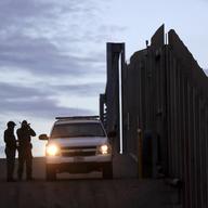 United States Border Patrol agents stand by a vehicle near one of the border walls separating Tijuana, Mexico and San Diego Wednesday, Nov. 21, 2018, in San Diego. 