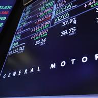 The logo for General Motors appears above a trading post on the floor of the New York Stock Exchange, Monday, Nov. 26, 2018. 