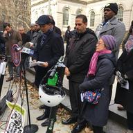Flanked by two electric scooters, City Council members made the case for why e-scooters and e-bikes should be legalized in New York City.