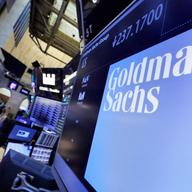 In this Dec. 13, 2016, file photo, the logo for Goldman Sachs appears above a trading post on the floor of the New York Stock Exchange.