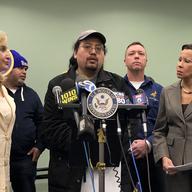 EPA employee, Antony Tseng (center), describes the challenges his family is facing during the federal government shutdown at a press conference organized by Rep. Nydia Velázquez (right).