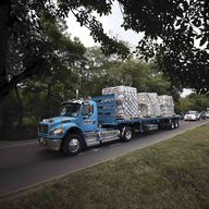Trucks loaded with USAID humanitarian aid for Venezuela are escorted by police as they arrive at the Tienditas International Bridge in Cucuta, Colombia