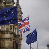 European flags and a British Union flag placed by anti-Brexit remain in the European Union supporters are blown by the wind across the street from the Houses of Parliament