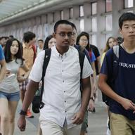 Students arrive for the first day of school at Stuyvesant High School, Wednesday, Sept. 9, 2015 in New York.