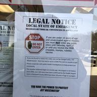 Sign posted on a store window in Rockland County as a result of an emergency order banning unvaccinated minors from public places.